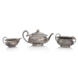 A George III three piece silver tea service by Solomon Hougham, London, 1813