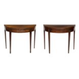 A pair of 19th century mahogany and boxwood strung demi-lune tea and games tables (2)