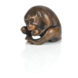 A netsuke of a monkey, with added Tomokazu signature