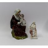 A large pearlware figure of the Madonna and Child and a figure of Charity circa 1800-15