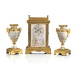 A late 19th/early 20th century French porcelain mounted gilt metal clock garniture