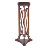 An late 19th/early 20th century Empire style mahogany torchere