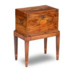 A George III and later mahogany and inlaid cellarette on stand