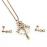 A peridot and seed pearl pendant, with chain and matched pendent earrings (2)