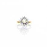 A fancy diamond floral cluster ring