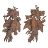 A PAIR OF BLACK FOREST CARVED WALNUT HUNTING TROPHIES OF DEAD GAMEBIRDS (2)