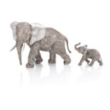 A modern silver model of an elephant and calf ensuite By Asprey & Co Plc, London 1985 (2)