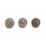 A group of THREE MOULDED MESH PATTERNED GUTTA-PERCHA GOLF BALLS ((3))
