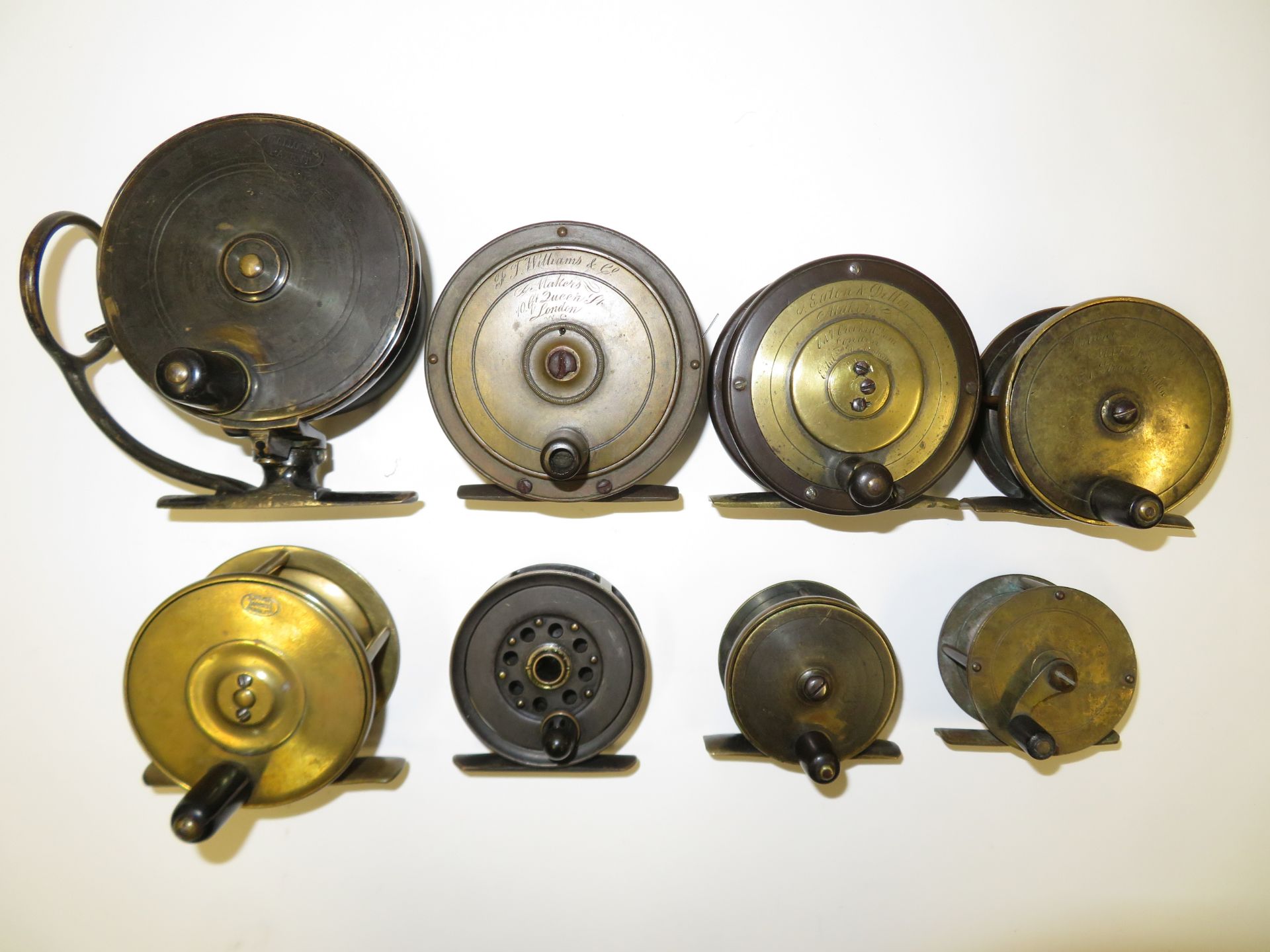 A collection of good early named brass reels