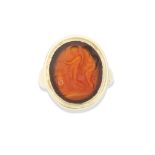 A carnelian intaglio of a satyr and a youth at an altar, probably Roman