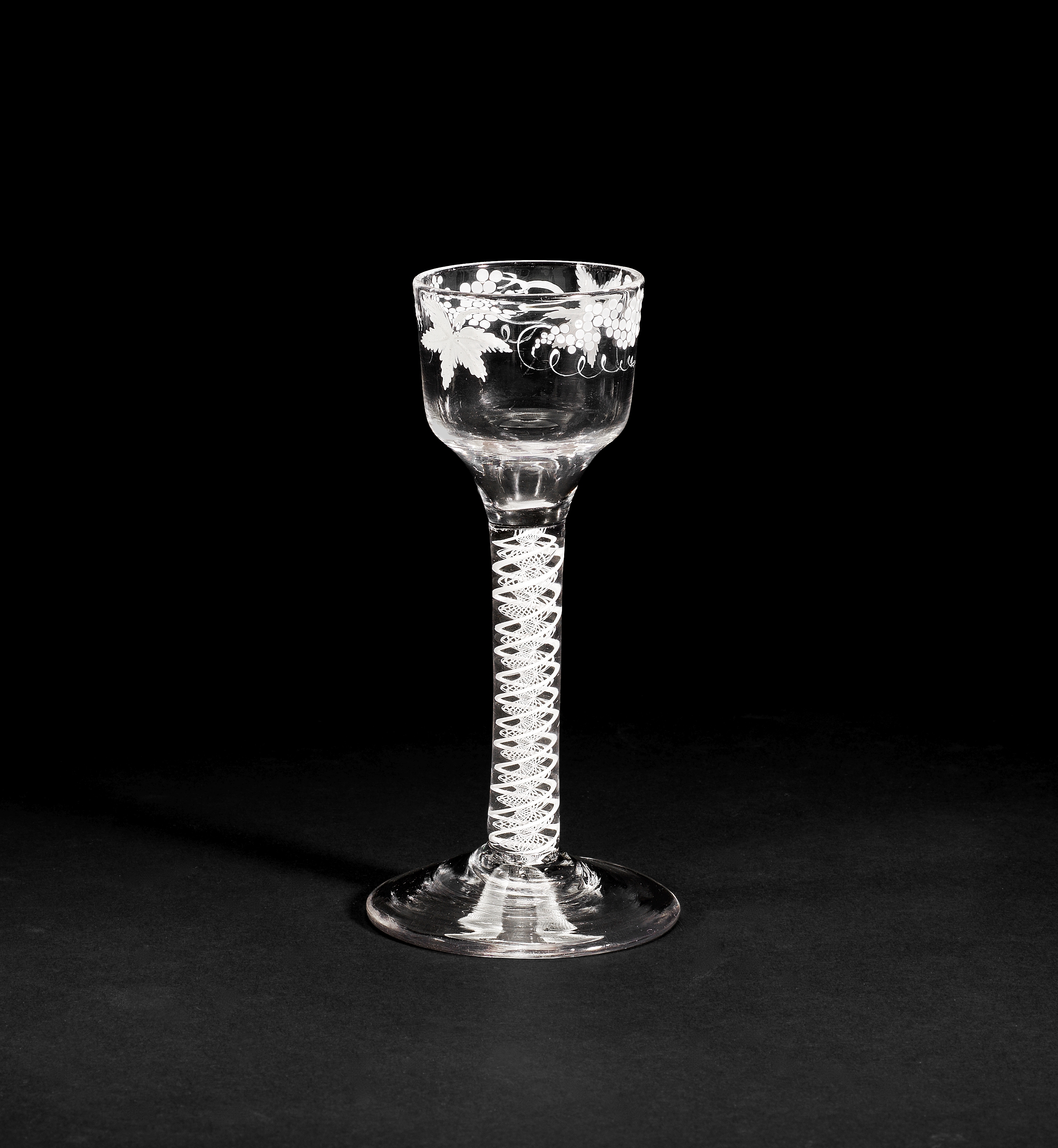 A Beilby enamelled opaque twist wine glass, circa 1765