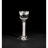 A Beilby enamelled opaque twist wine glass, circa 1765