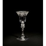 An engraved light baluster wine glass, circa 1750