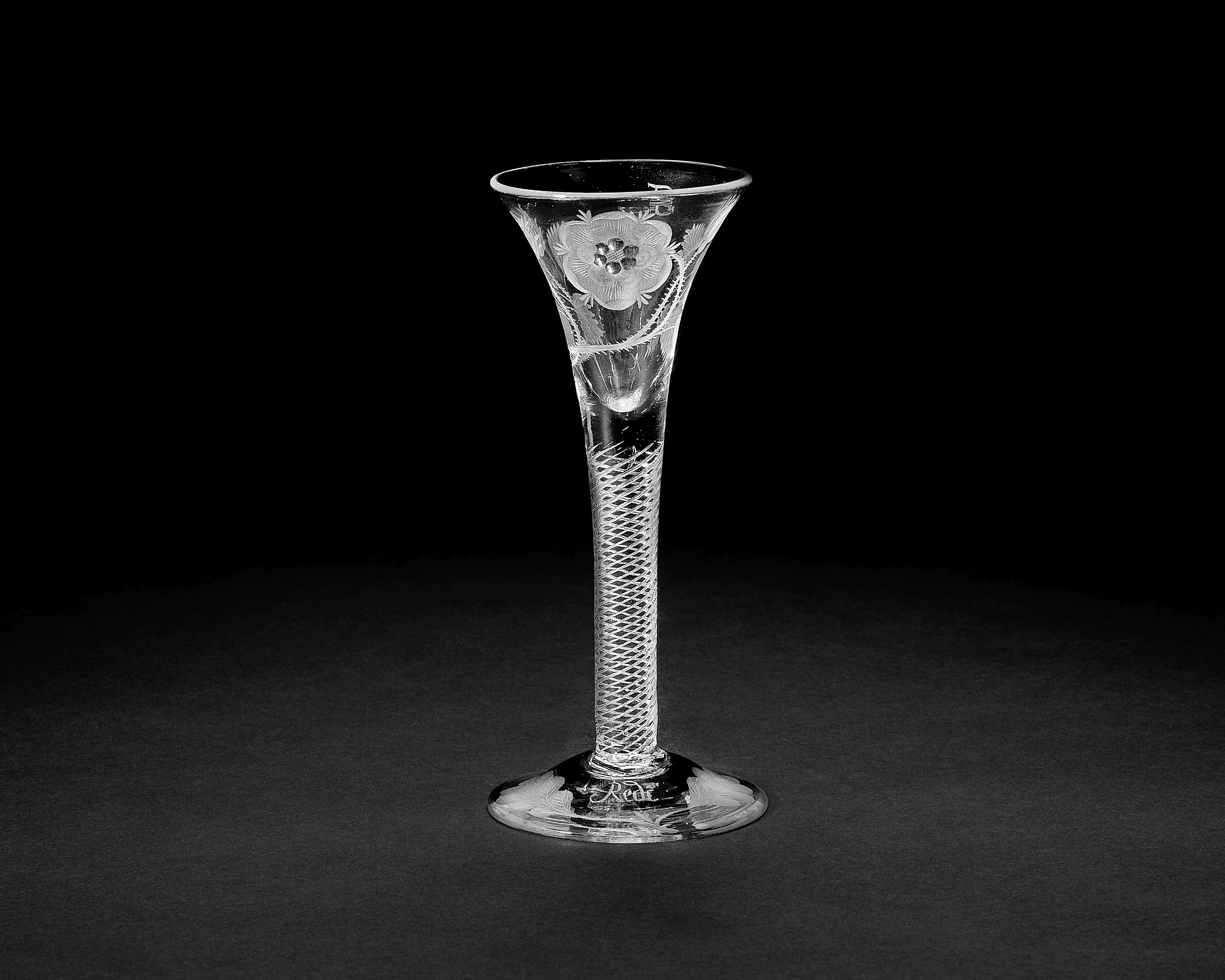 A rare Jacobite engraved airtwist wine glass, circa 1750