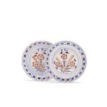 A pair of London delftware plates, dated 1724