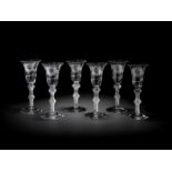 A rare set of six Jacobite engraved airtwist wine glasses, circa 1750