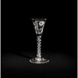 An engraved airtwist cordial glass, circa 1750