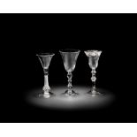 A composite-stem wine glass and two light baluster glasses, circa 1750-60