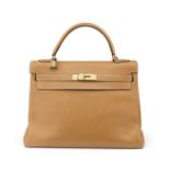 Gold Clemence Kelly Retourne 32, Hermès, c. 1985, (Includes padlock, keys, cloche, associated sho...