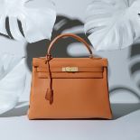 Orange H Swift Kelly Retourne 32, Hermès, c. 1998, (Includes padlock, keys, cloche and shoulder s...