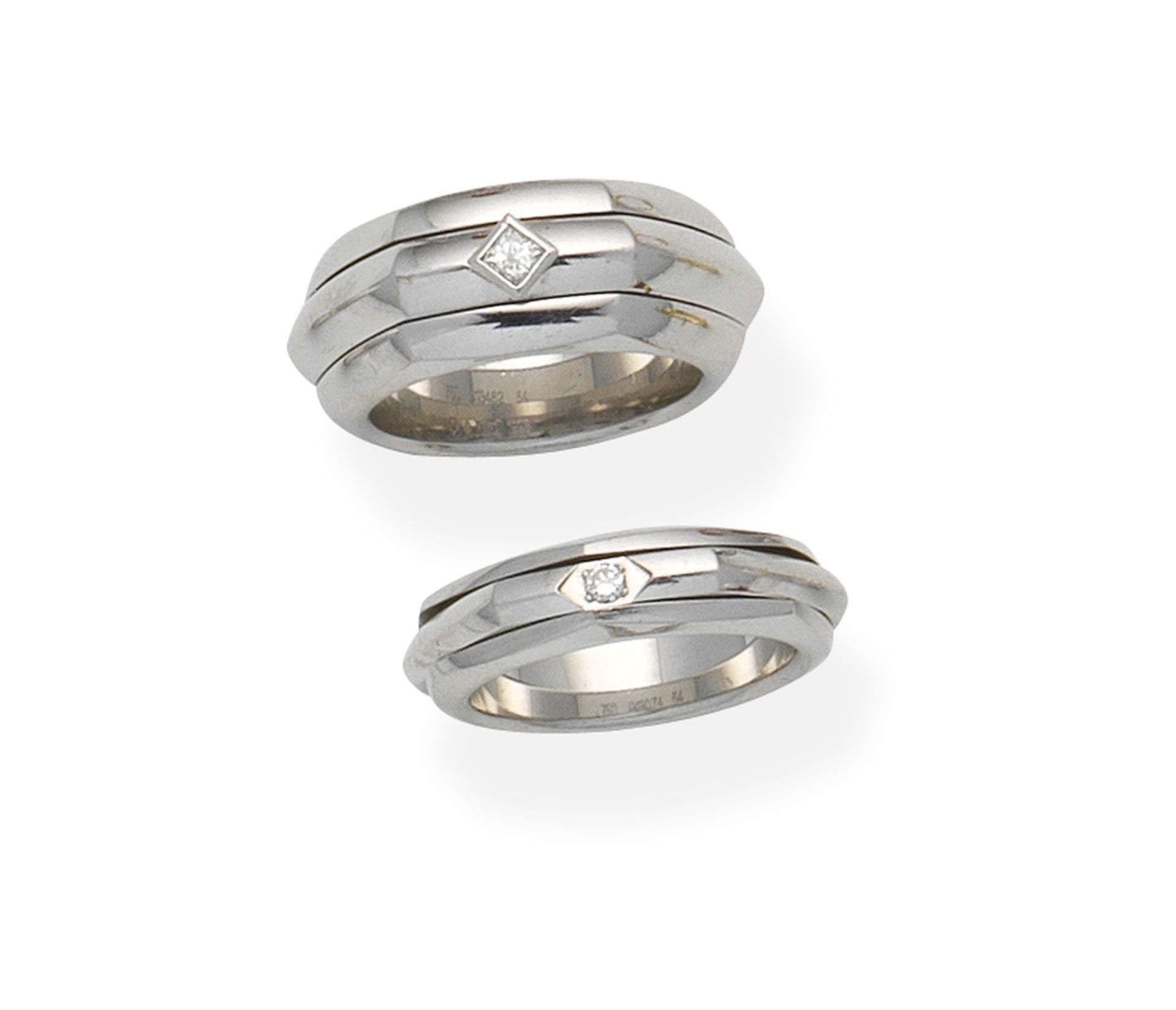 Piaget: Two diamond 'Possession' rings, (2)