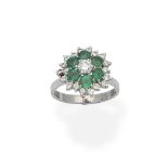 An emerald and diamond cluster ring by Bunda