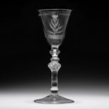 An engraved light-baluster wine glass mid 18th Century