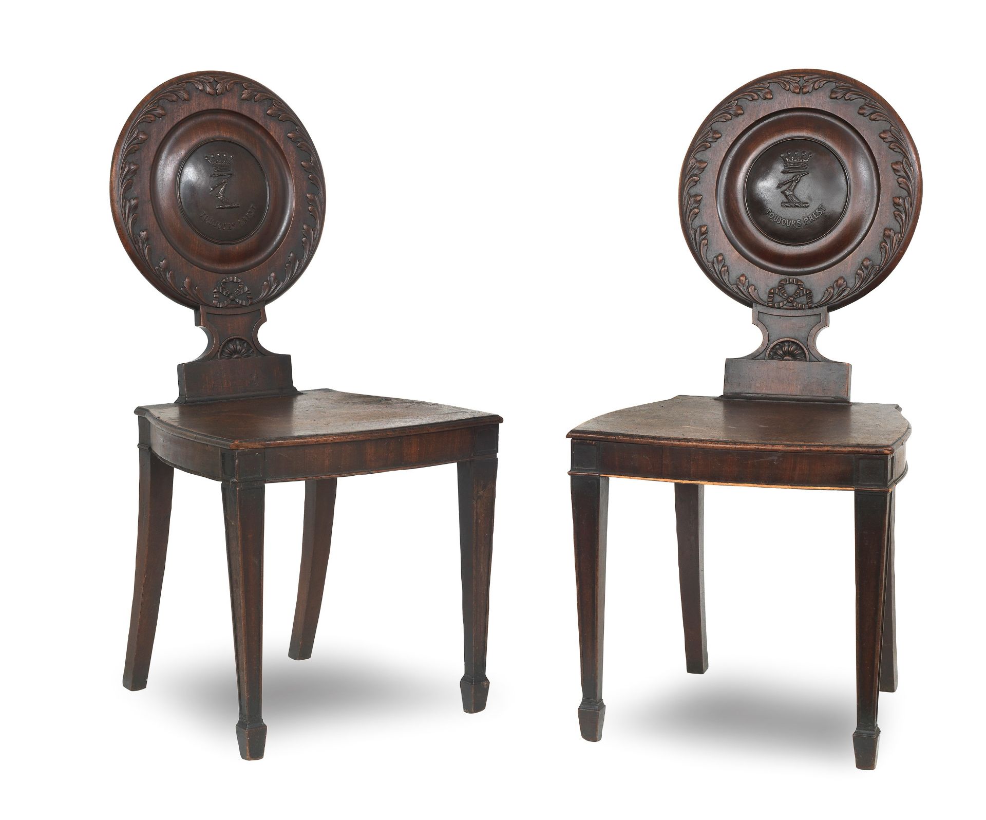 A pair of George III mahogany hall chairs