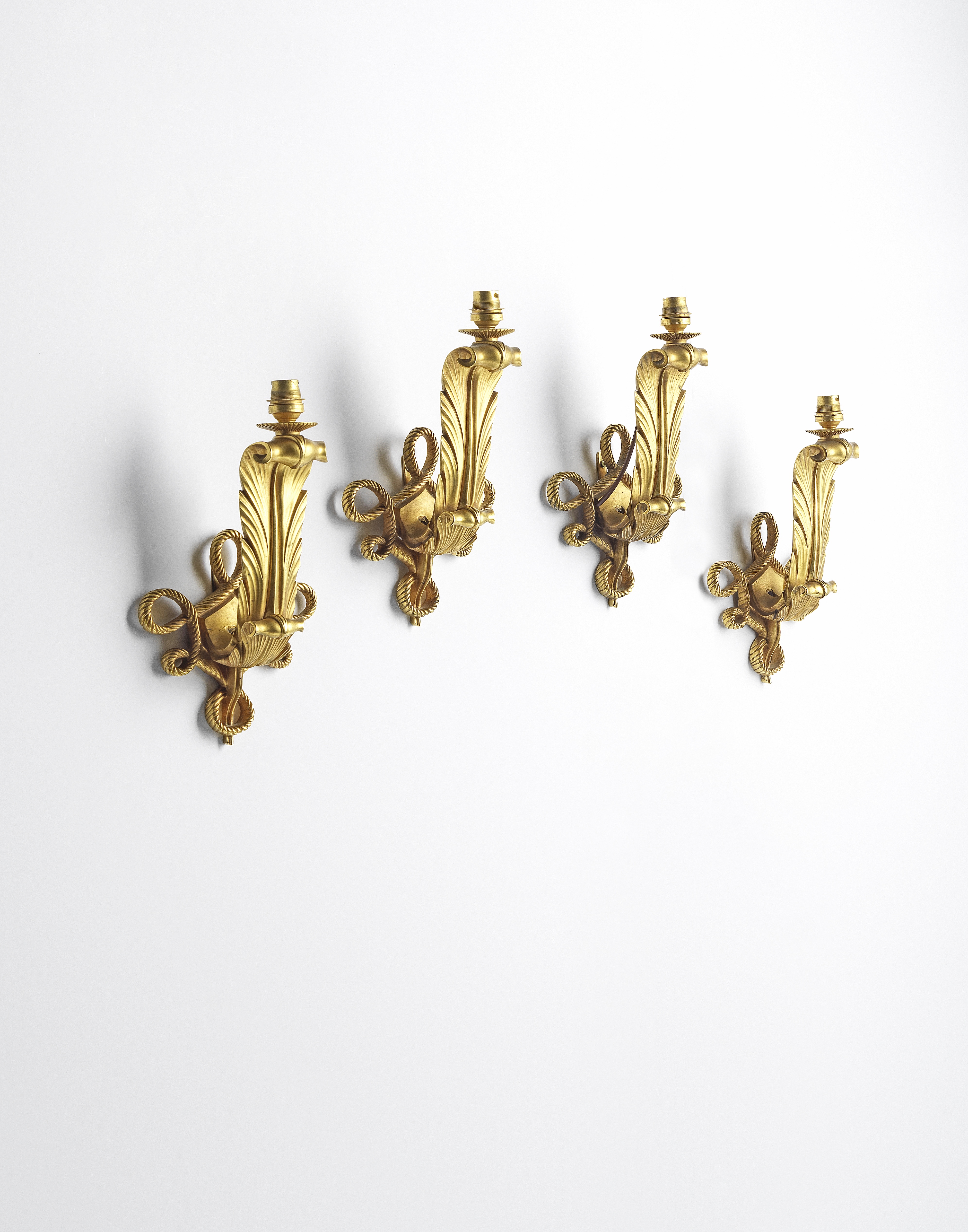 Jules Leleu Set of four 'Acanthe' wall lights, designed 1947