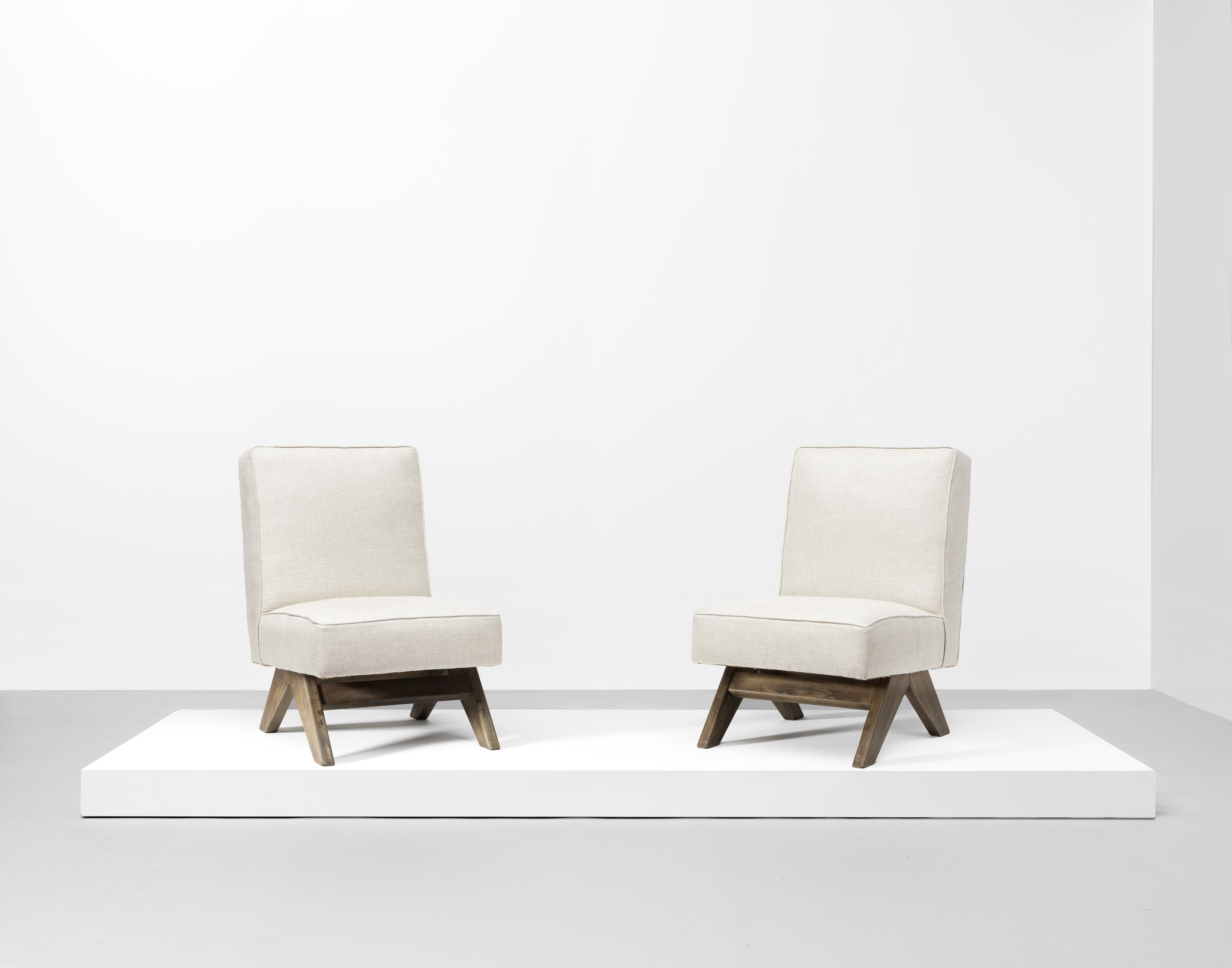 Pierre Jeanneret Pair of low chairs, model no. PJ-SI-36-A, designed for the High Court and P. U....