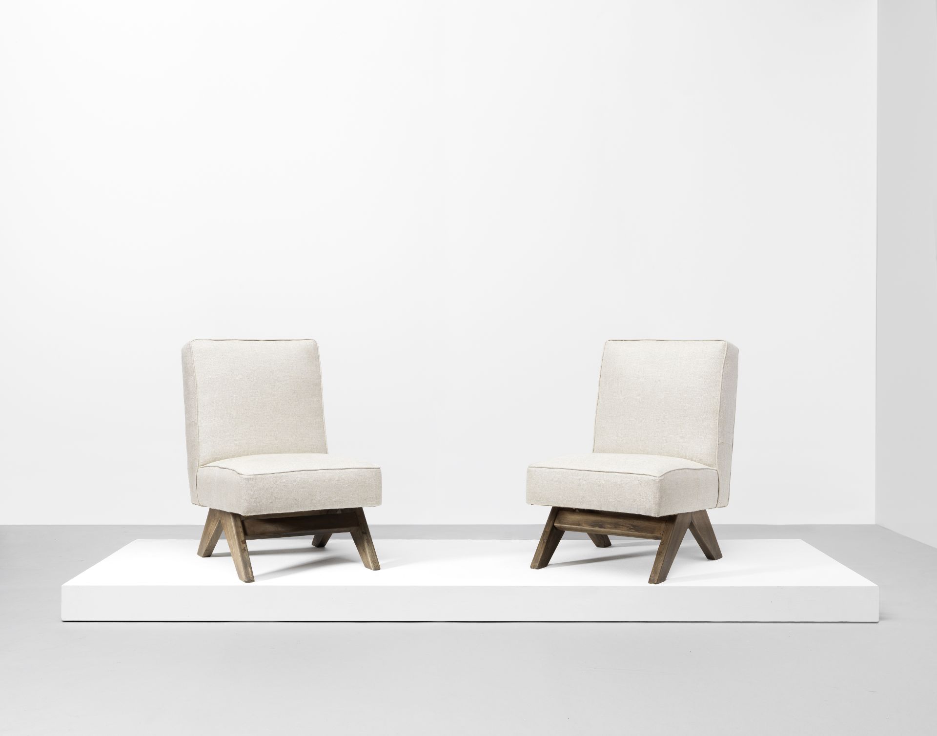 Pierre Jeanneret Pair of low chairs, model no. PJ-SI-36-A, designed for the High Court and P. U....