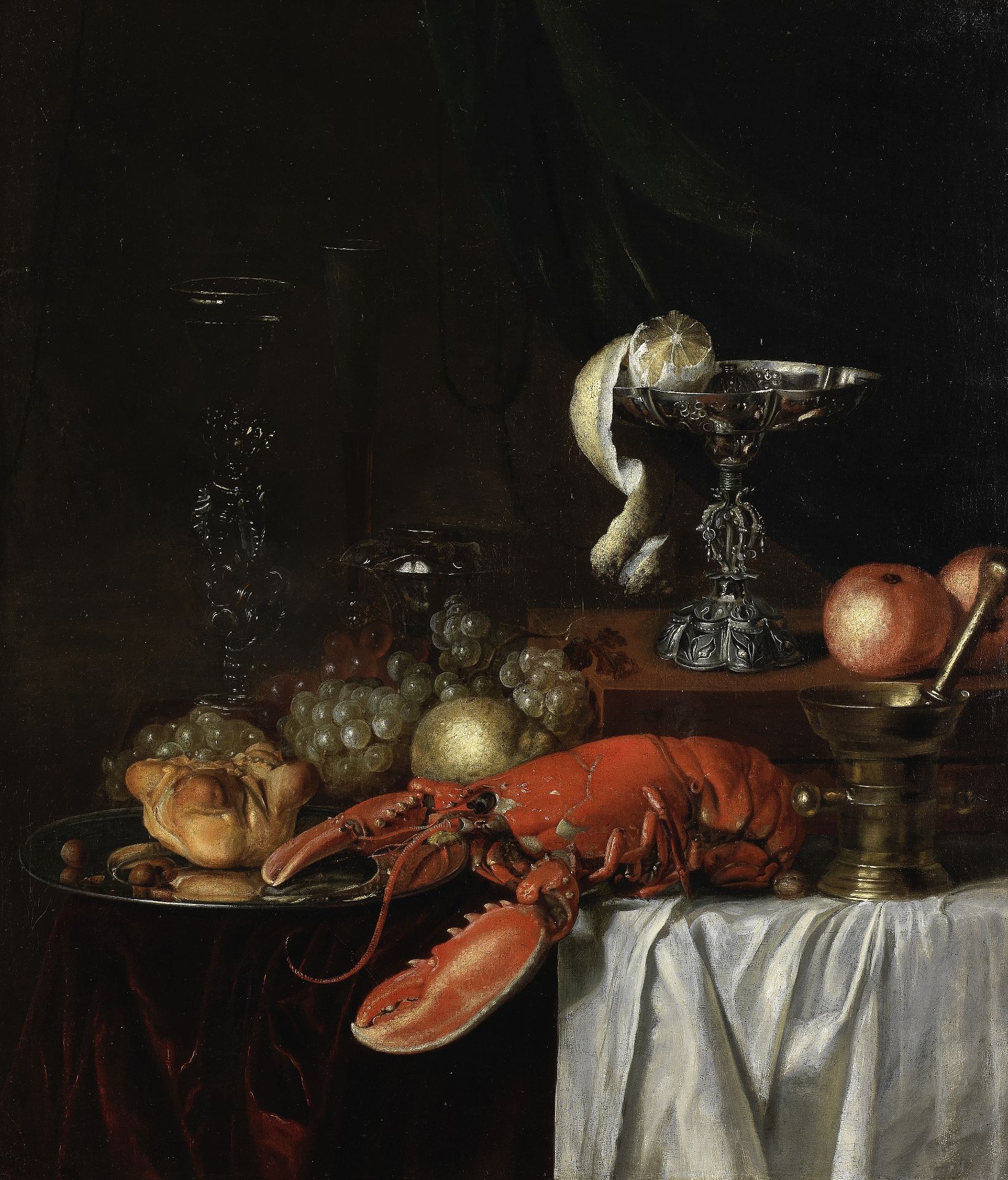 Follower of Willem Kalf (Rotterdam 1619-1693 Amsterdam) A lobster, fruit, silver goblet, a peeled...