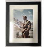 A signed photograph of Sean Connery as James Bond with the 'Goldfinger' Aston Martin DB5,
