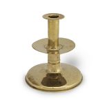 An unusual mid-to late 17th century brass alloy trumpet-based socket candlestick, English, circa ...