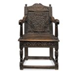 A good Charles I joined oak panel-back open armchair, West Country, circa 1630