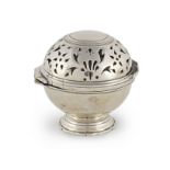 A silver-plated brass soap and sponge ball