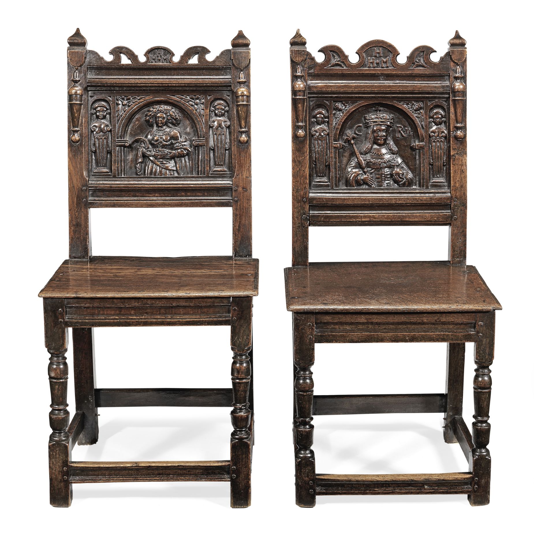 An unusual pair of Charles II joined oak figural-carved backstools, Cheshire/Lancashire, circa 16...