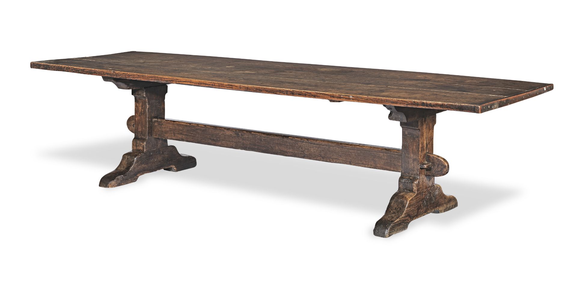A good and large early 18th century elm and ash trestle-end table, English