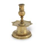 A brass alloy socket candlestick