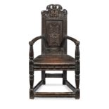 An extremely rare James I/Charles I joined oak caqueteuse armchair, Aberdeenshire, circa 1620-40