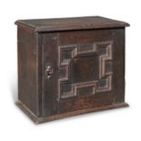 A Charles II oak table-top spice cupboard, circa 1680