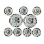 A pair of George III London (Lambeth) delft chargers, with seven similar plates, circa 1775 (9)