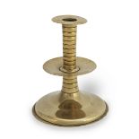 A rare mid-17th century brass trumpet-based socket candlestick, English, circa 1650-70