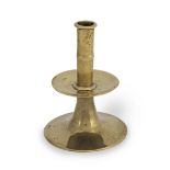 A good mid-17th century brass trumpet-based socket candlestick, English, circa 1660