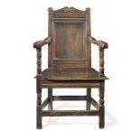 A Charles II joined oak panel-back open armchair, Yorkshire, circa 1670