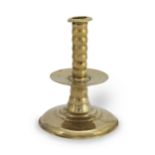 A mid- to late 17th century brass alloy trumpet-based socket candlestick, circa 1650-80