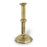 An early 18th century brass ejector socket candlestick, English/French, circa 1720