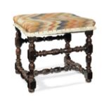 An 18th century fruitwood and upholstered stool, French