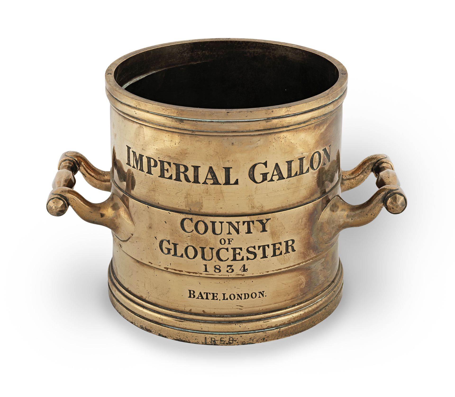 A William IV brass alloy Imperial Standard measure, of gallon capacity, for the County of Glouces...