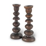 A pair of 19th century turned beech candlesticks (2)